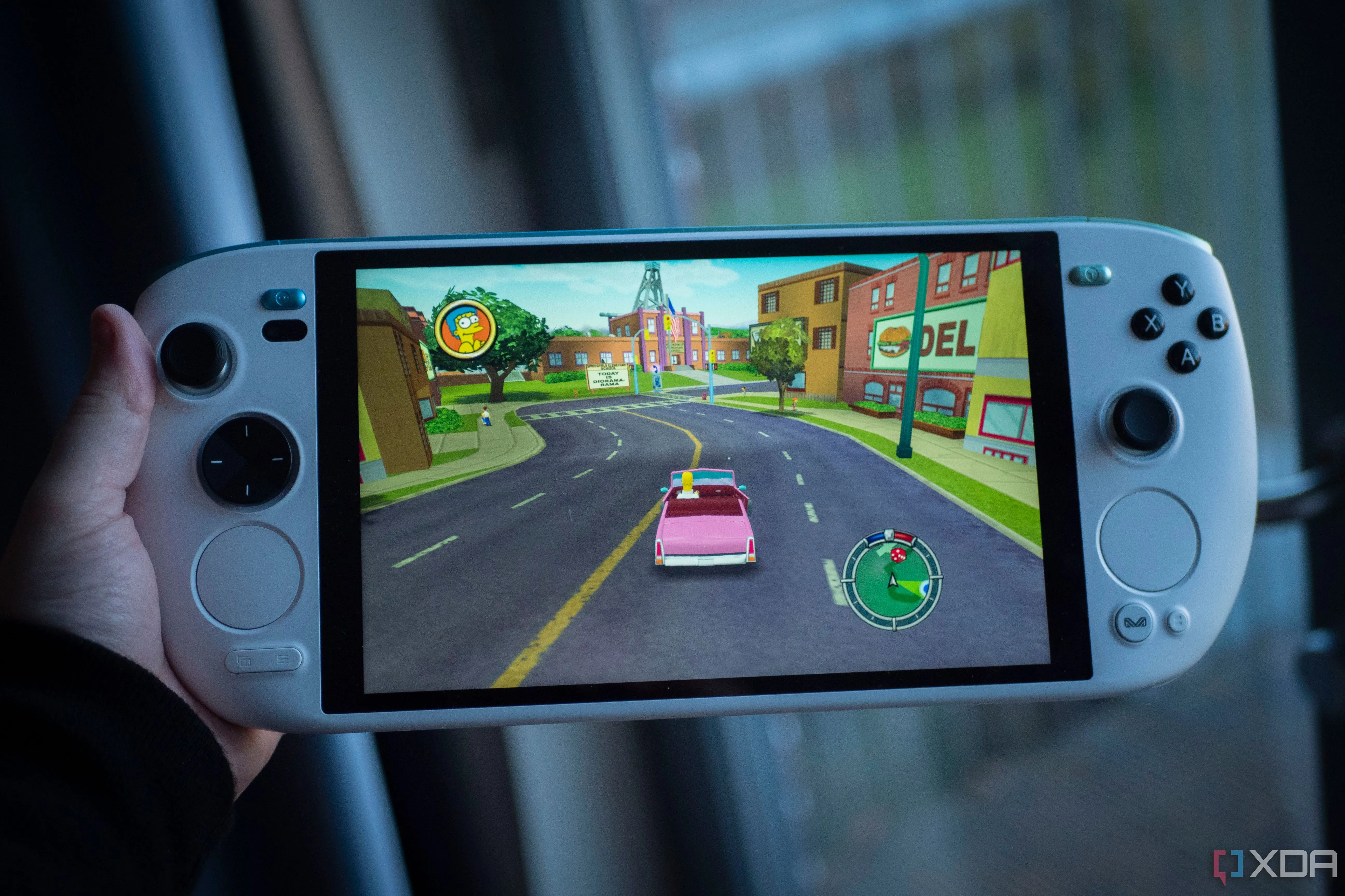 Ayaneo Kun running the Simpsons Hit and Run in hand