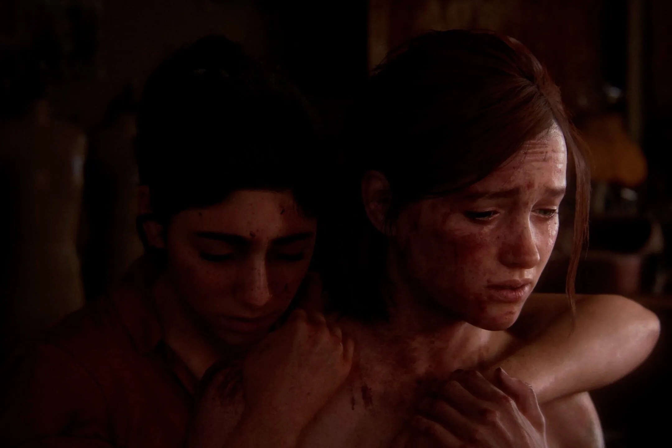 Ellie và Dina ôm nhau trong game The Last of Us Part II, thể hiện mối quan hệ sâu sắc giữa hai nhân vật và ảnh hưởng của Dina đến quyết định của Ellie.