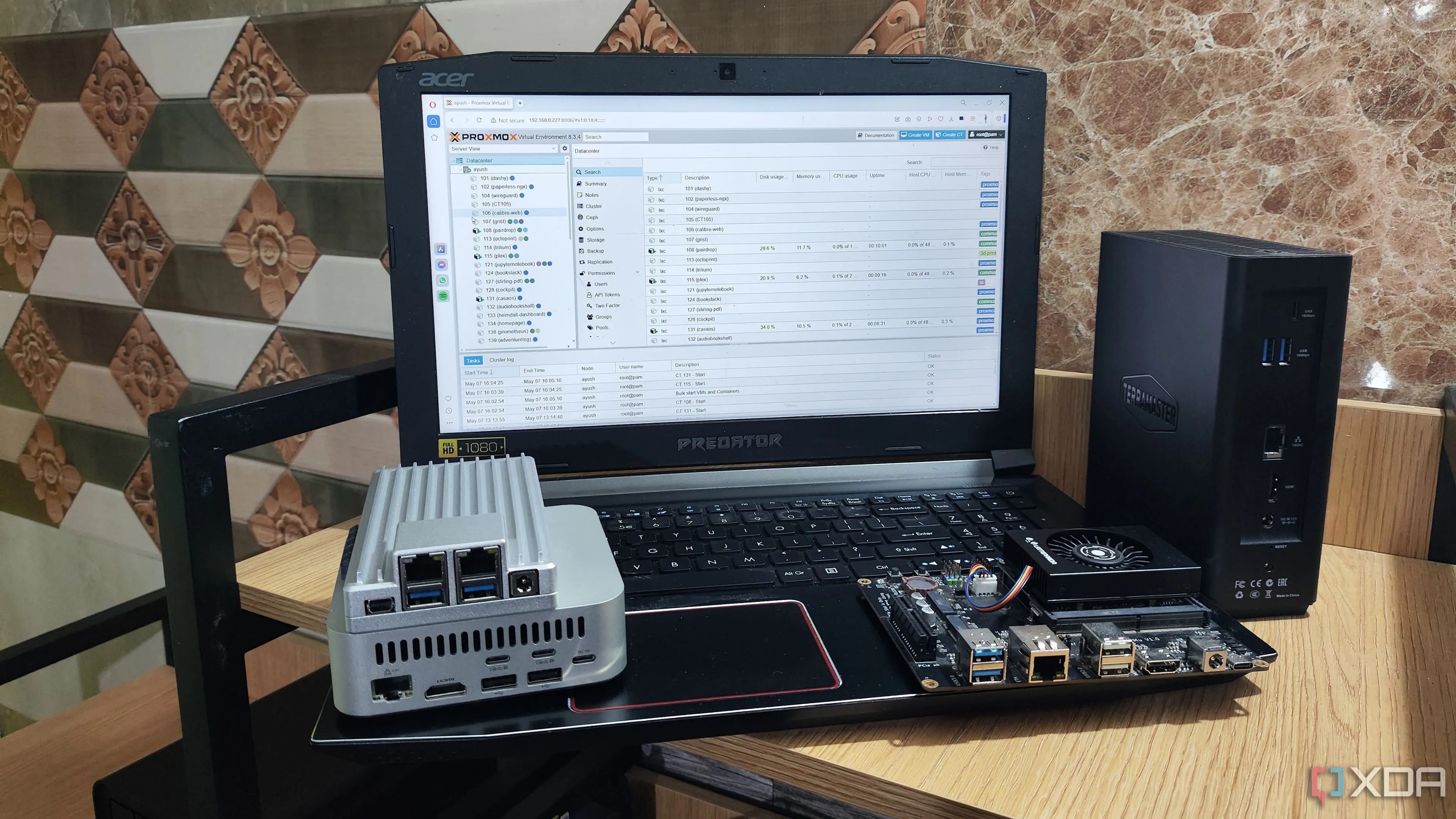 Giao diện quản lý web của Proxmox VE được truy cập từ máy tính xách tay, thể hiện sự tiện lợi trong việc quản lý các máy ảo và toàn bộ hệ thống home lab.