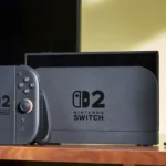 Hình ảnh minh họa máy chơi game Nintendo Switch 2 và camera trên bàn, biểu tượng cho tính năng tương thích ngược game với Switch đời đầu