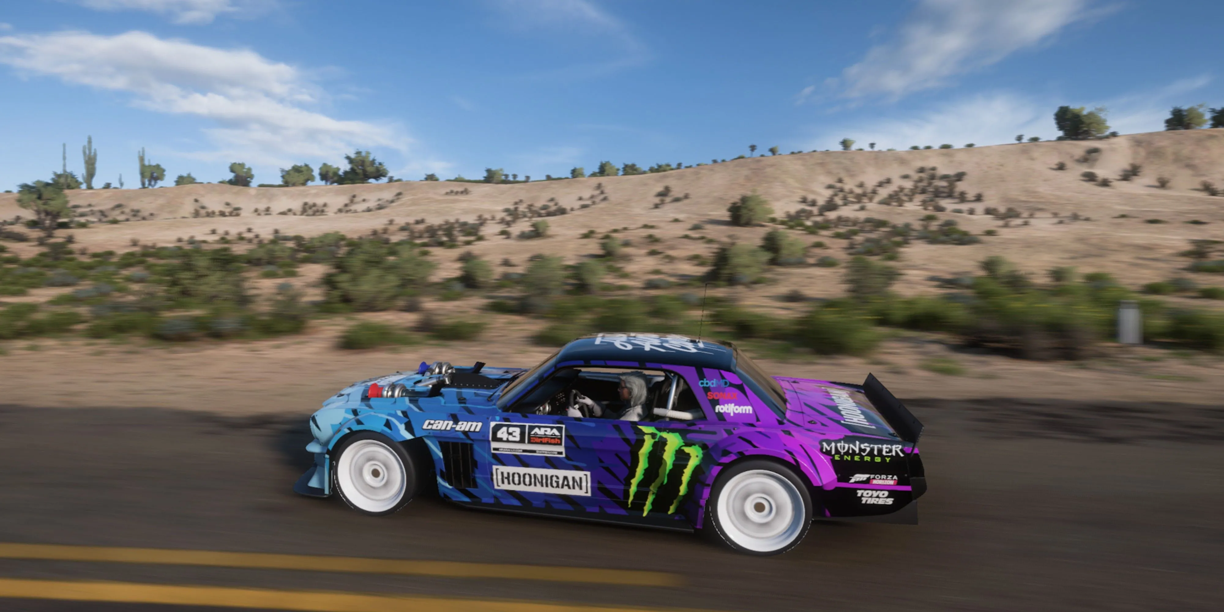 Hoonigan Ford Hoonicorn Mustang chạy trên đường trong Forza Horizon 5