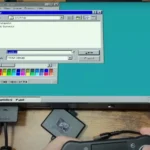 Màn hình PlayStation 2 hiển thị giao diện Windows 95 đang hoạt động, minh chứng cho dự án chạy hệ điều hành cổ điển trên console game.
