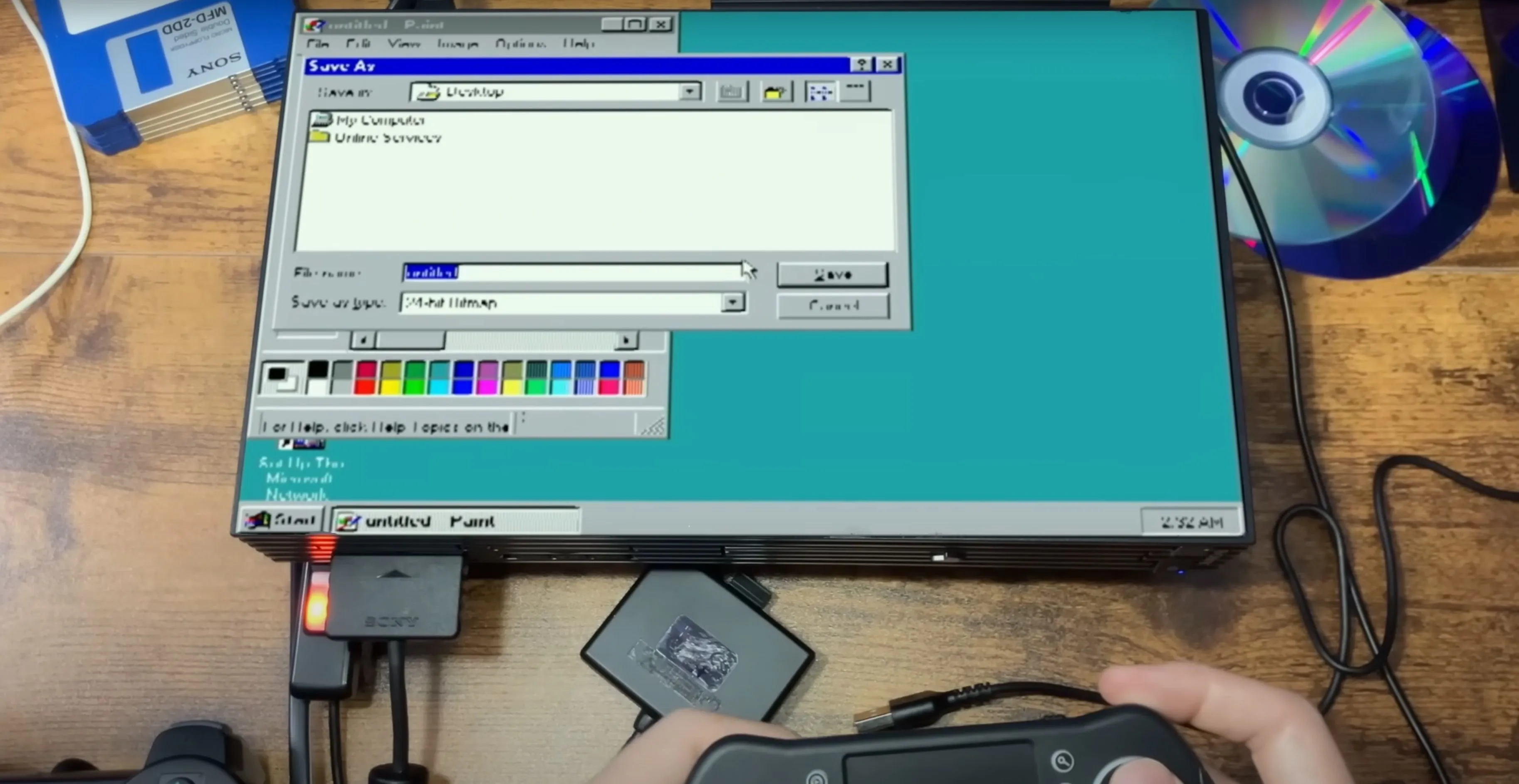 Màn hình PlayStation 2 hiển thị giao diện Windows 95 đang hoạt động, minh chứng cho dự án chạy hệ điều hành cổ điển trên console game.