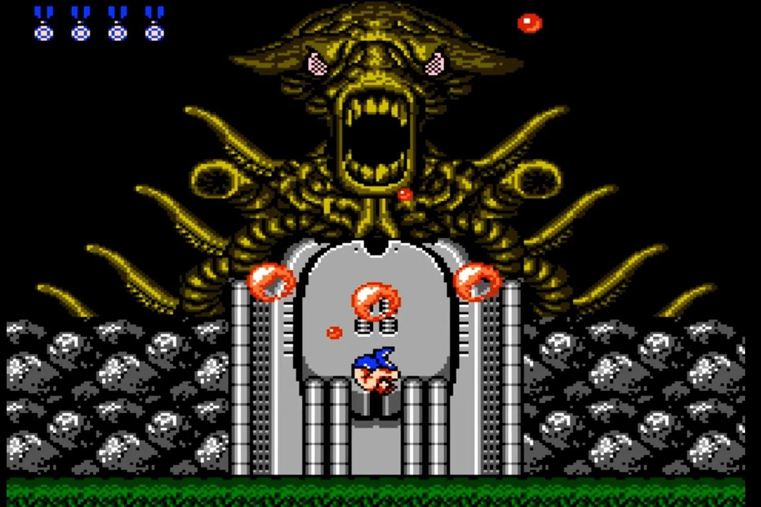 Người chơi đối đầu với boss ngoài hành tinh trong game bắn súng Contra trên NES