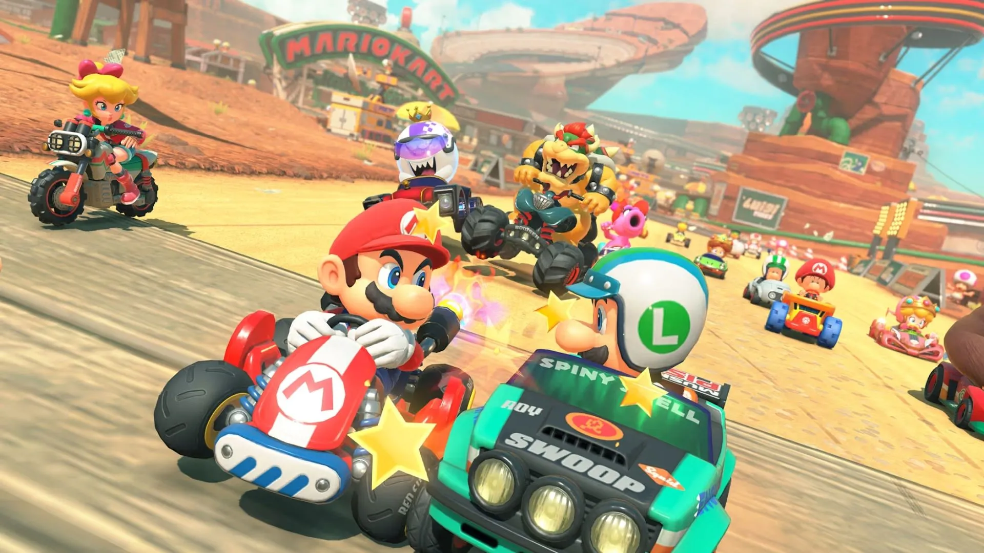 Xe đua của Toad trong Mario Kart World đang vượt qua đối thủ trên đoạn đường xoắn ốc
